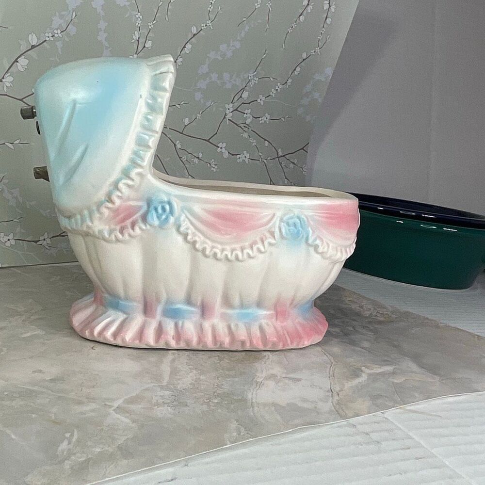 Inarco E- 3502 musical baby bassinet planter.